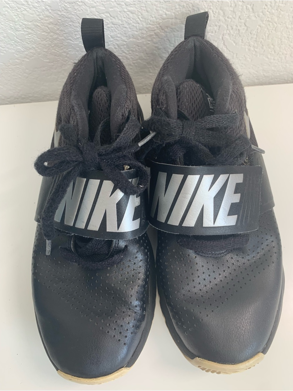 Nike Kid’s Black Athletic Sneakers with Bold Silver Logo Strap